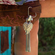 Floral skirt with angel wing keychain.