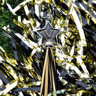 Star-shaped pendant with tassel on pom-poms.
