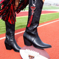 Cowgirl boots and football on track.